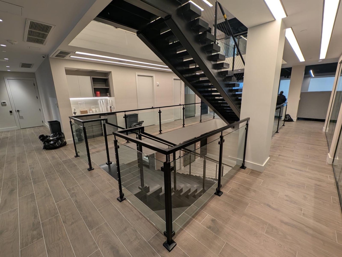 Steel staircase with glass railings