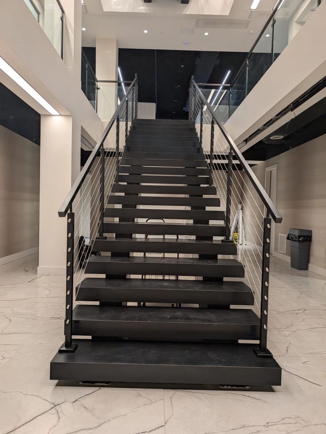 Steel staircase with cable railing