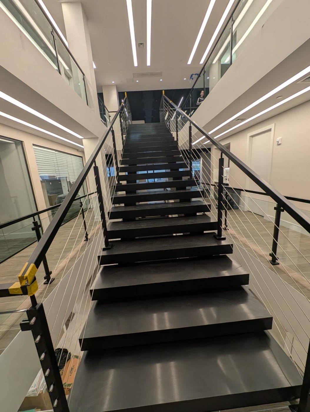Steel staircase with cable railings