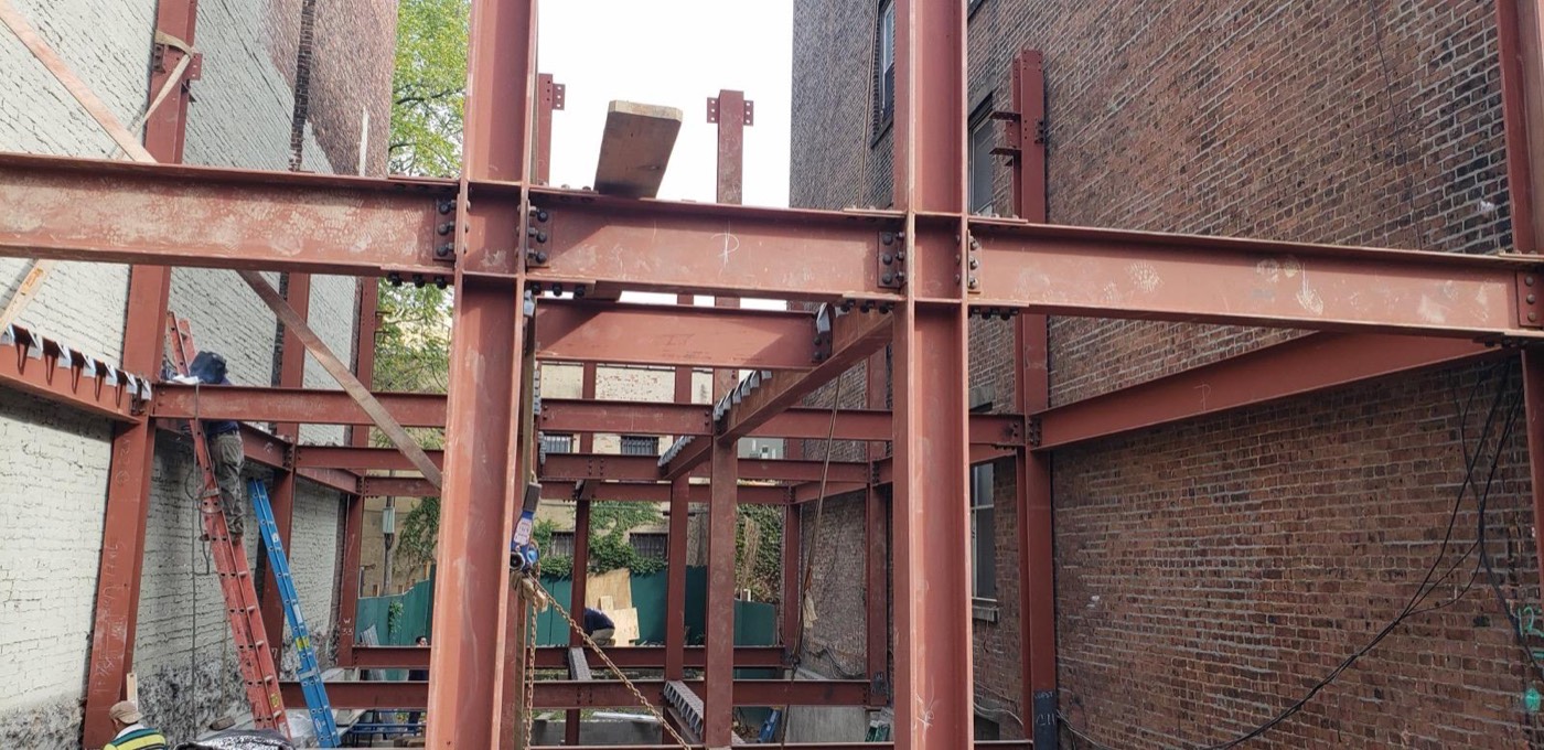 Structural steel frame between buildings
