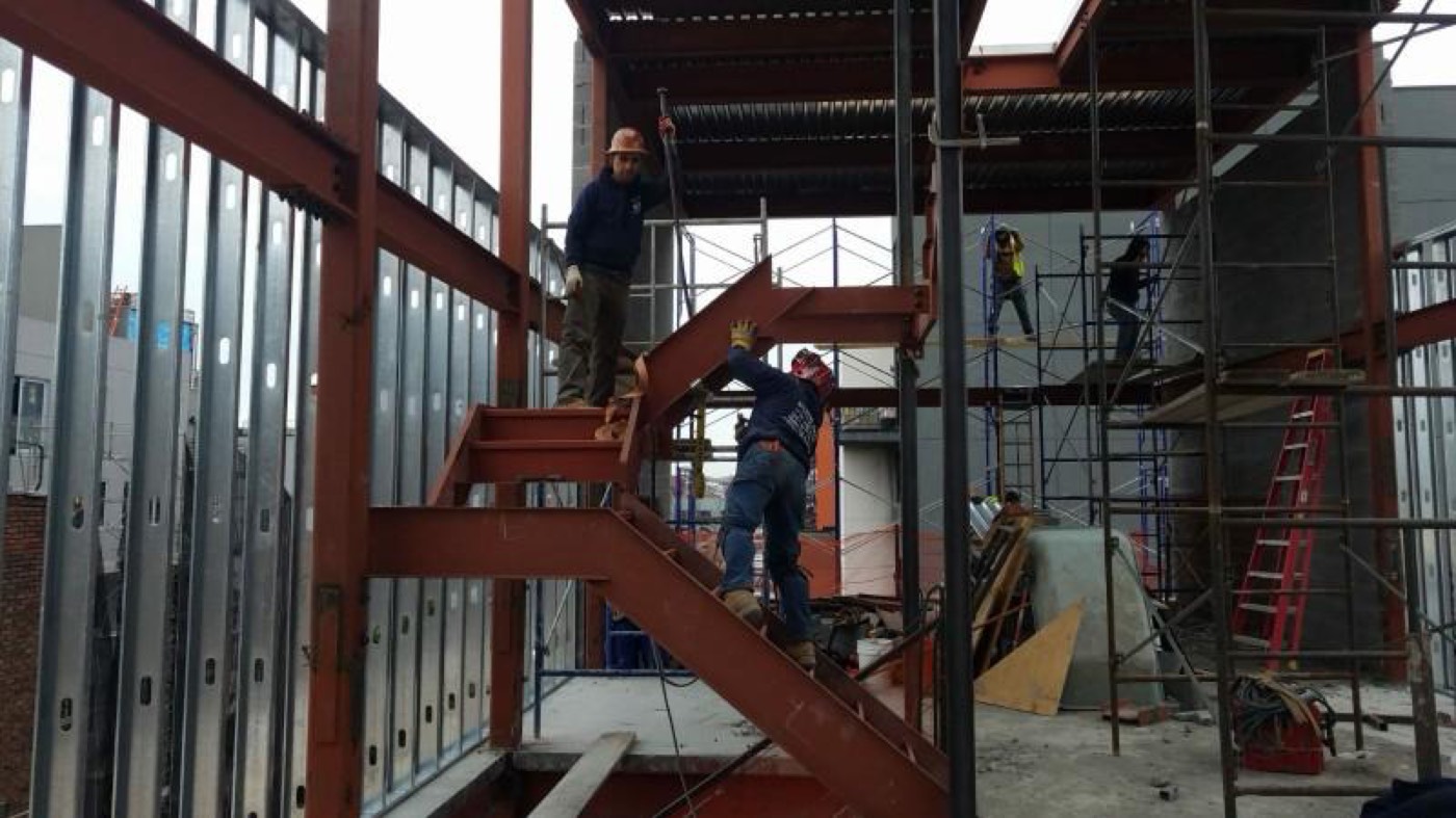 Steel erection with crew on site