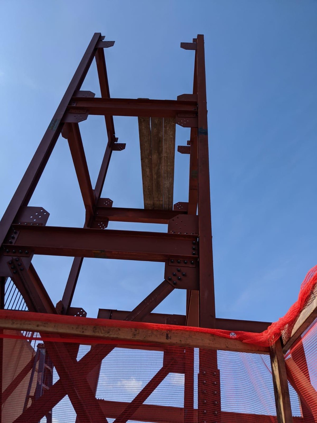 Structural steel column against sky
