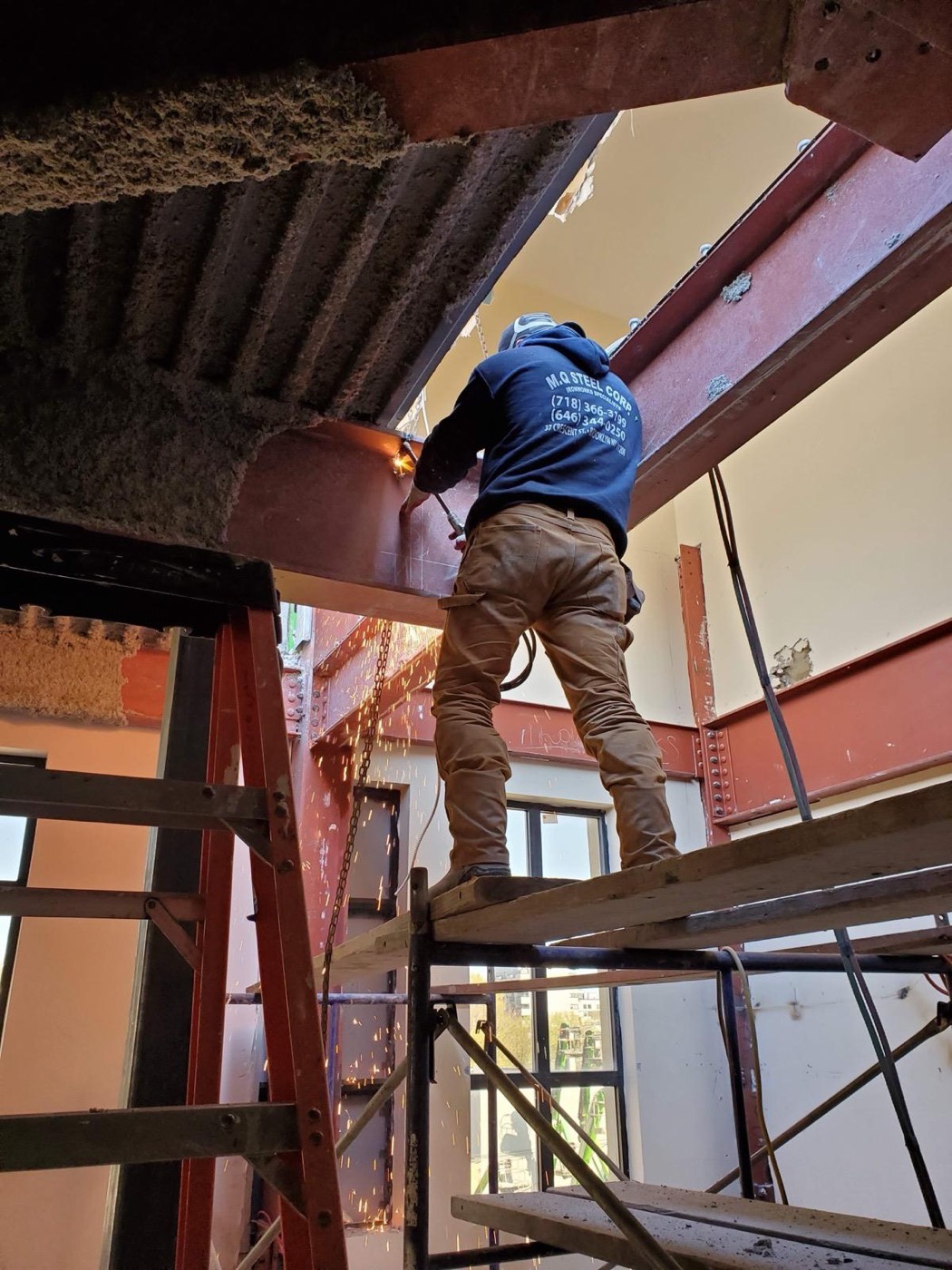Overhead welding on scaffold